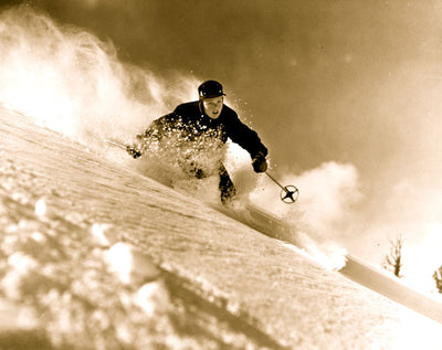 Vintage photo of Alf Engen skiing in powder.